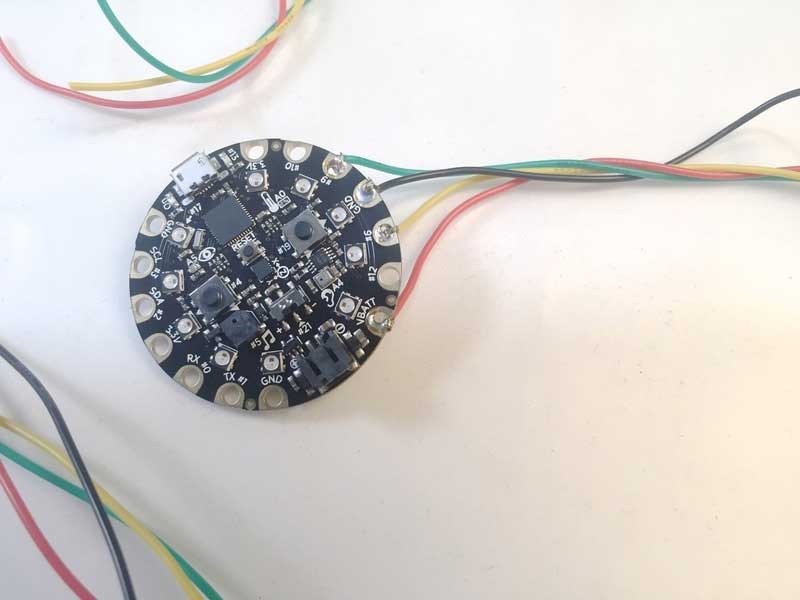 Solder the four wires to the Circuit Playground