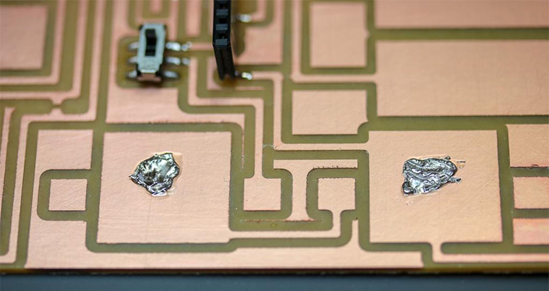 Apply solder to the middle of each battery pad area