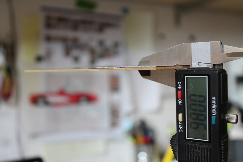 Use digital calipers to measure the thickness