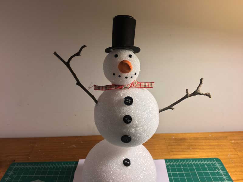 Adding the snowman body and facial features