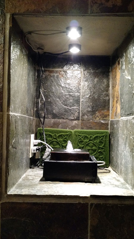 Installed fountain/moss tiles/power strip