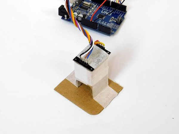 Sensor itself is placed in a small cardboard housing 