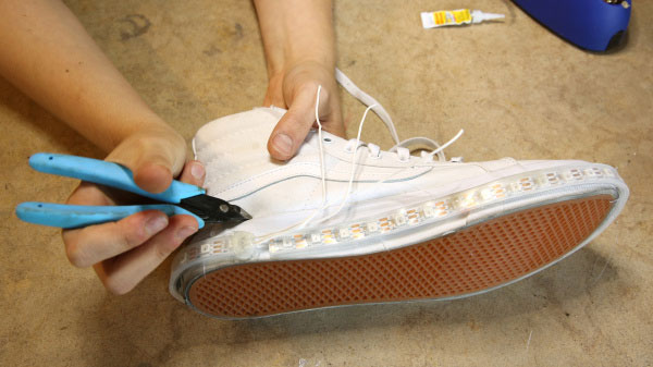 Make a hole in the shoe directly above the end