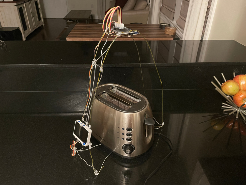 Toaster with cage and sensors