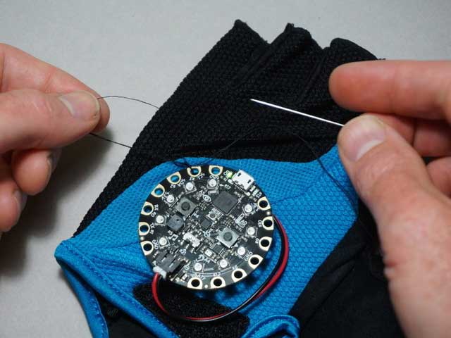 Sew the thread through the pad holes