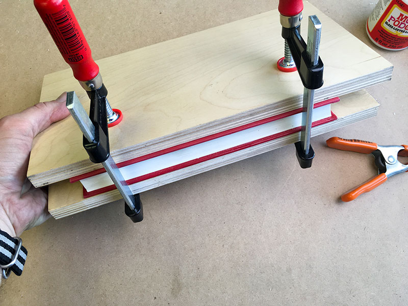 Close book/place it between two boards/clamp it